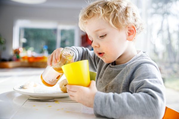 child drinking juice